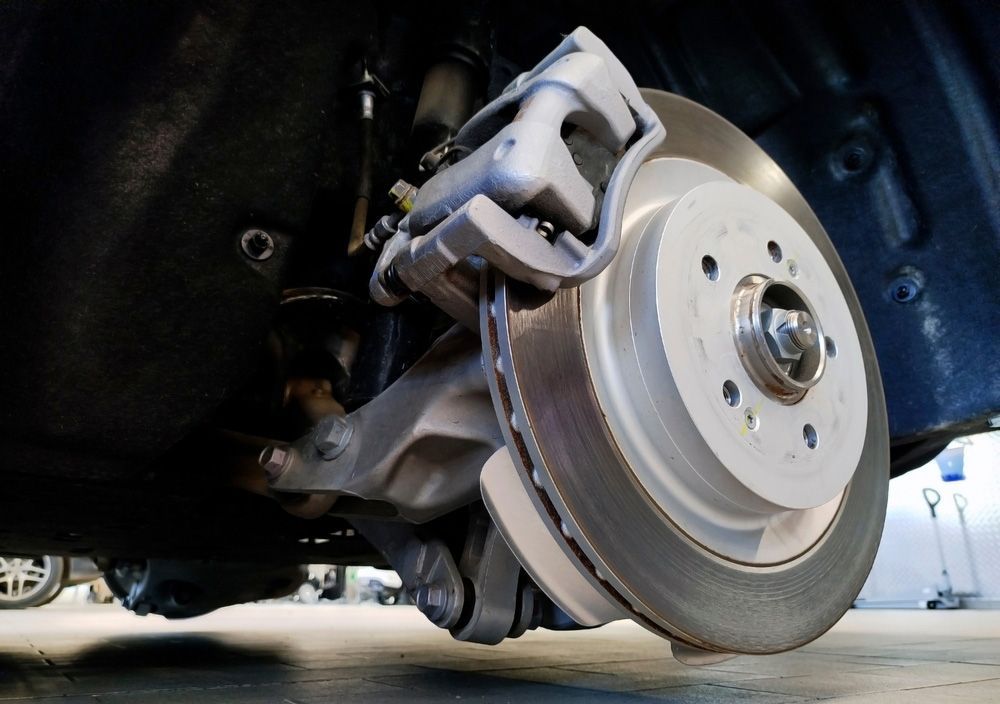 A close up of a brake disc on a car