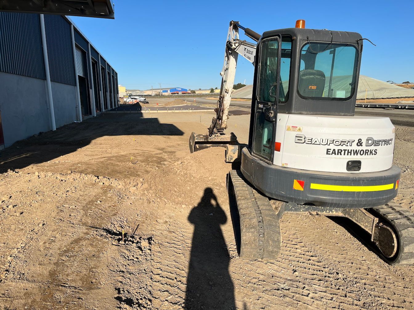 An excavator is moving dirt — Beaufort & District Earthworks in Beaufort, VIC