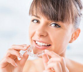 Orthodontist — Woman Going to Wear Mouth Guard in Essex, MA