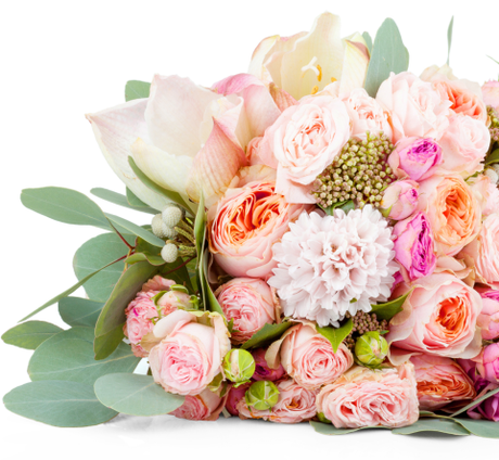 Pastel pink and white flower bouquet with roses, lilies, and green leaves on a white background
