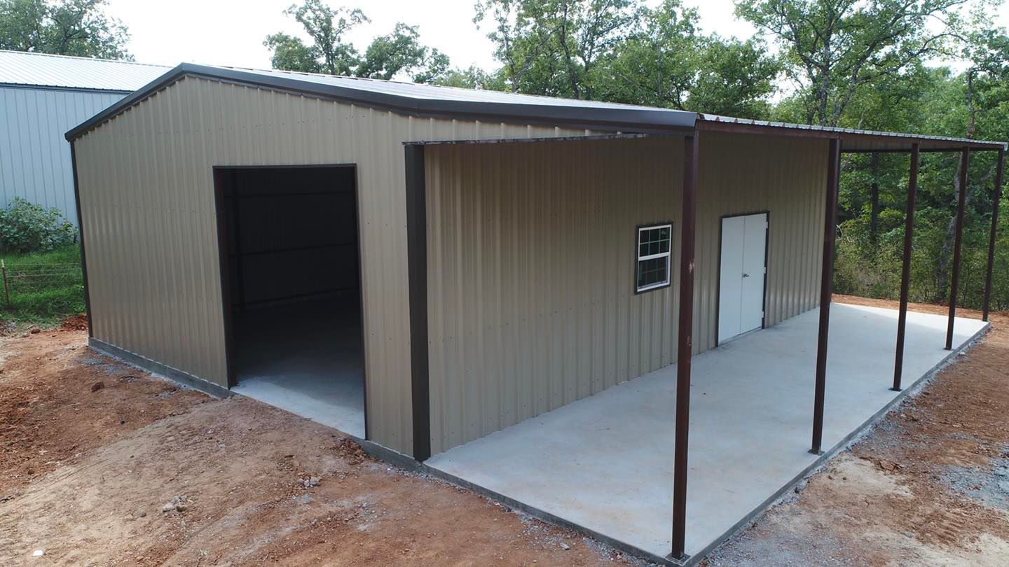 An aerial view of a metal garage with a porch.