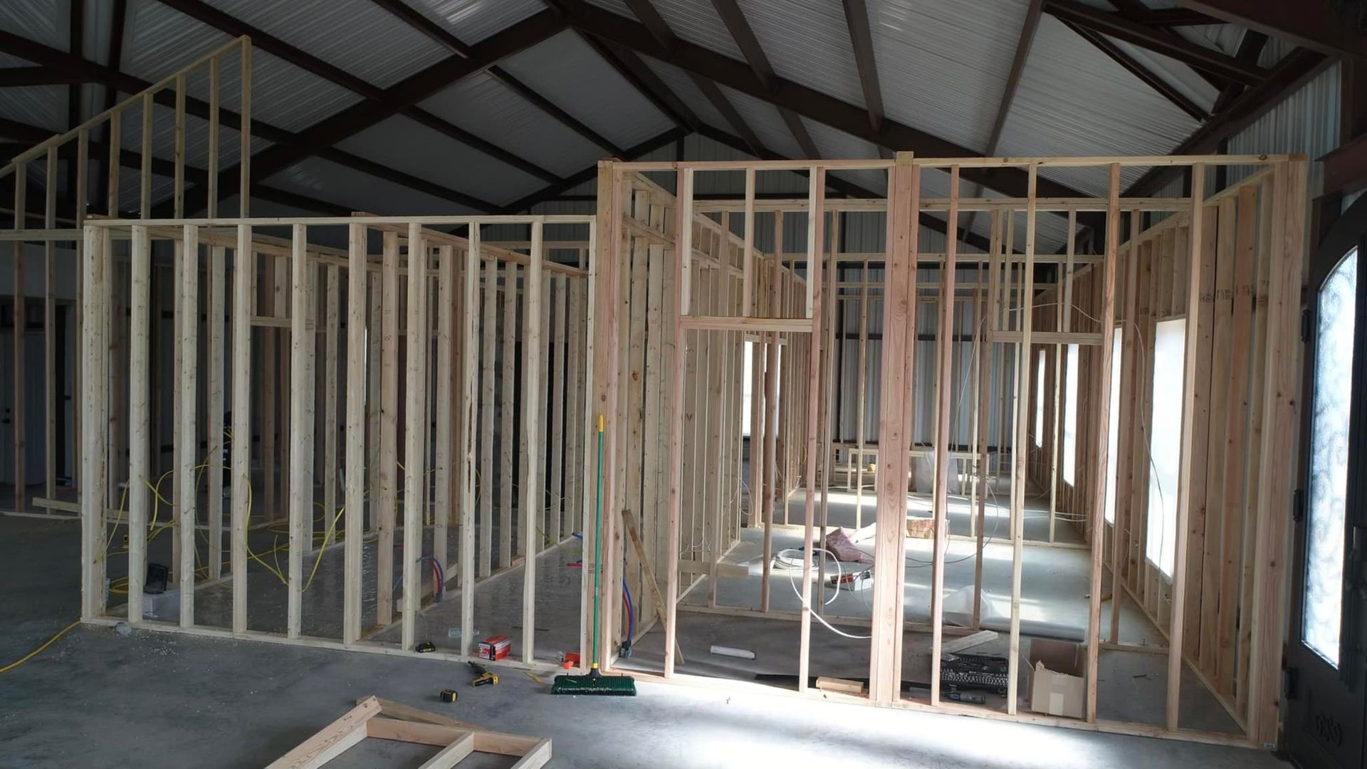 A large room with a lot of wooden frames in it.