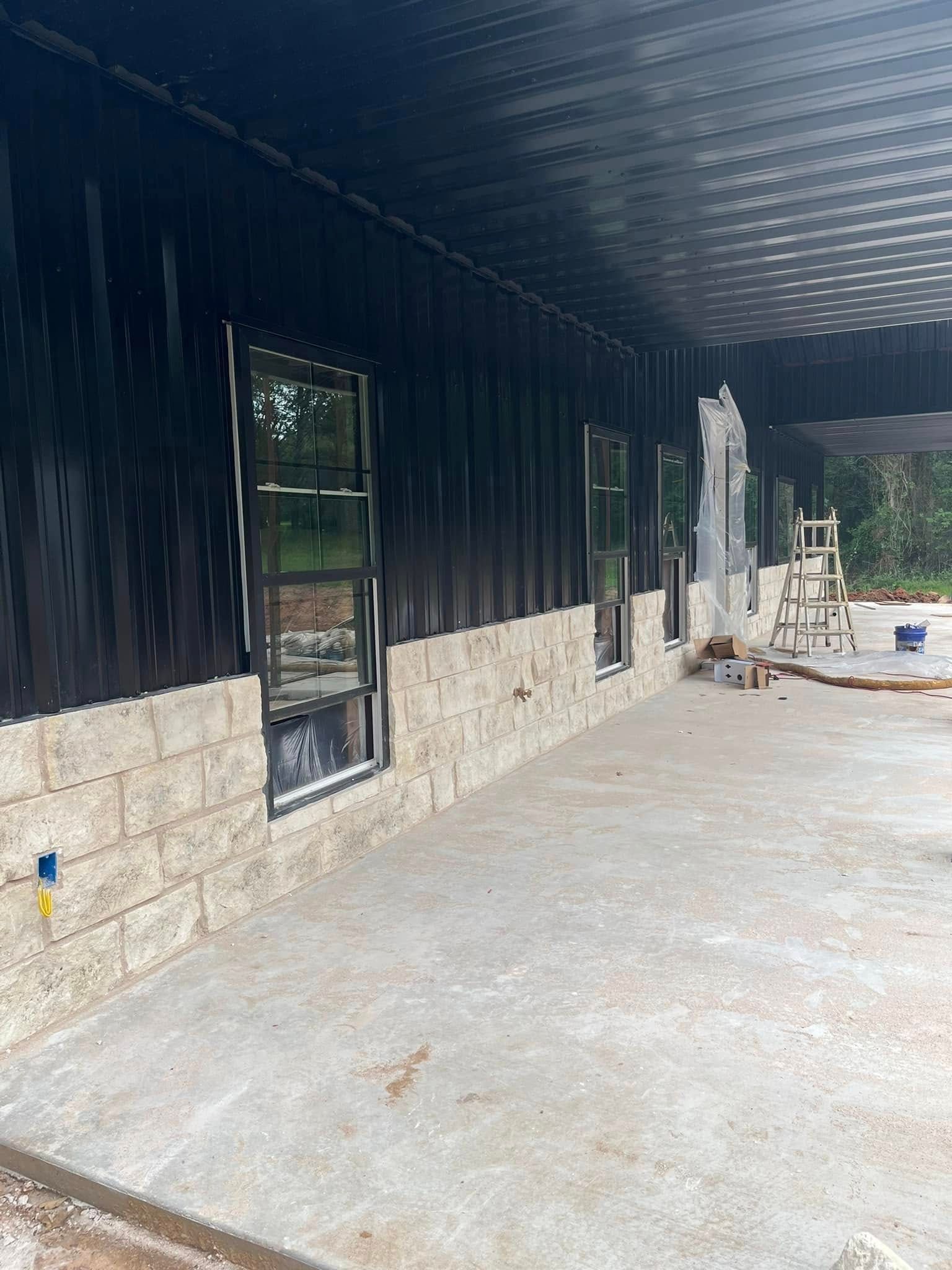 A building under construction with a lot of windows and a concrete floor.