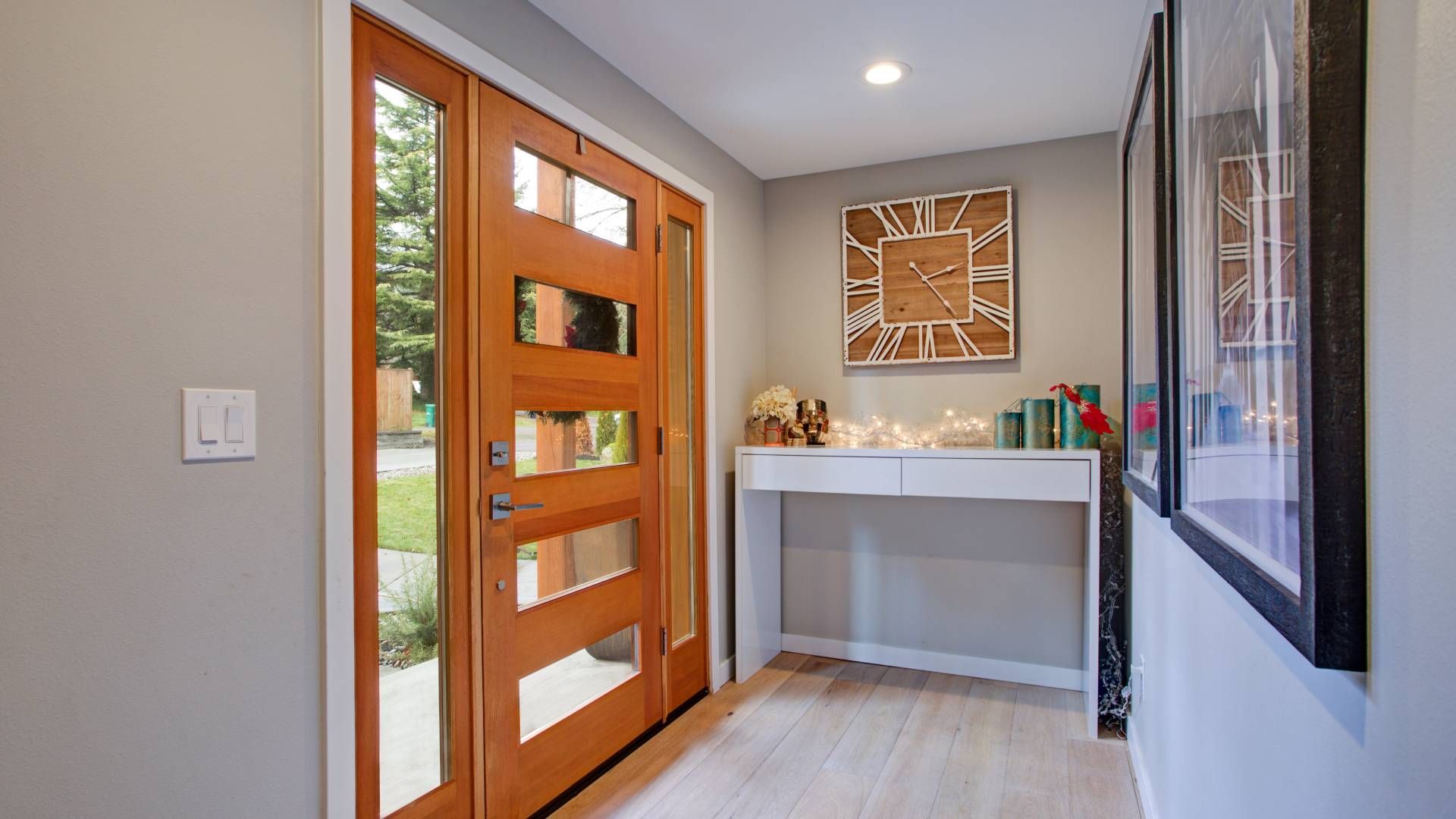 An elegant entryway with a glass-paneled door and sidelights at Awnings, Blinds, & Shutters near Tur