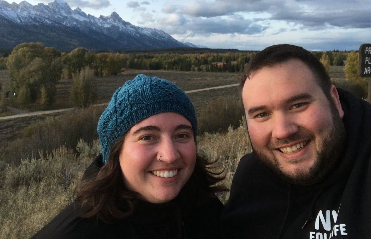 Aria and Alex  with mountains in the background