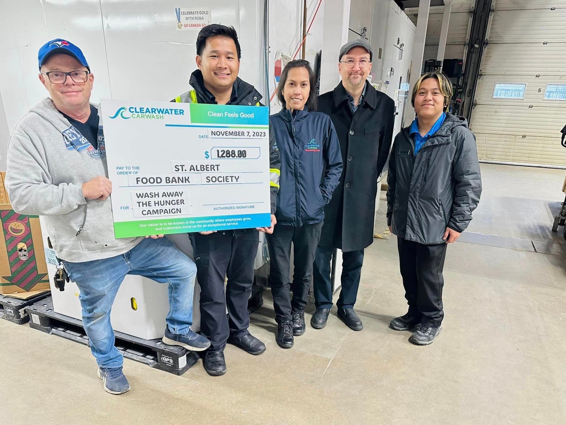 Clearwater team with donation check to St. Albert Food Bank