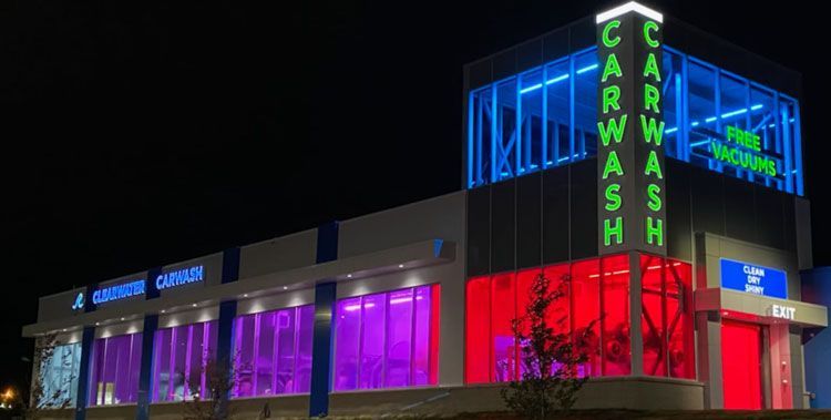 ClearWater CarWash at night lit up with multiple colors