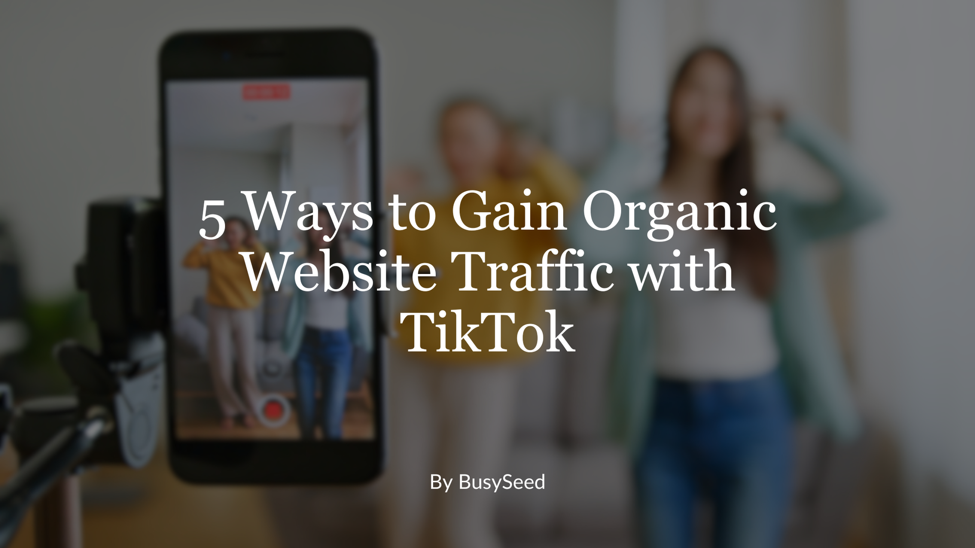 Smartphone filming two women dancing; text overlay: