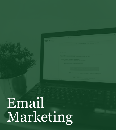 A green background with a laptop and the words email marketing