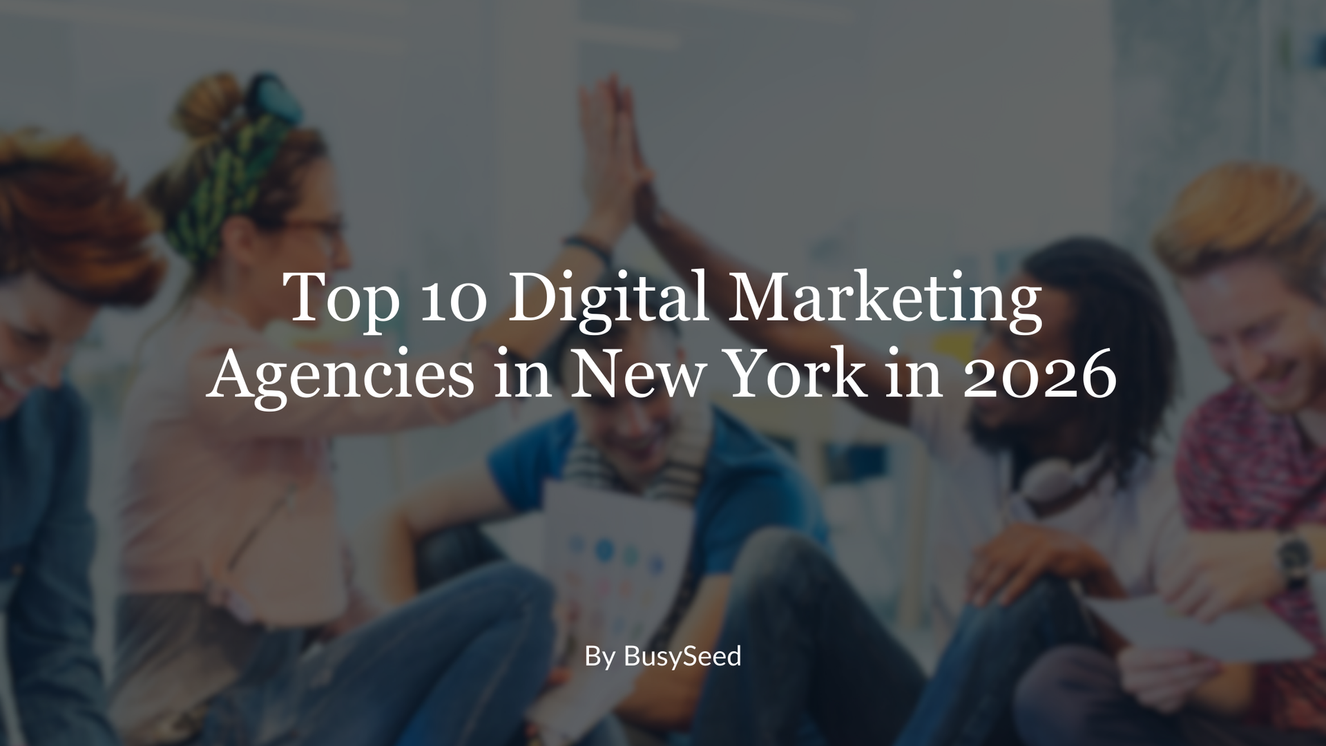 A group of people are sitting on the floor giving each other a high five.