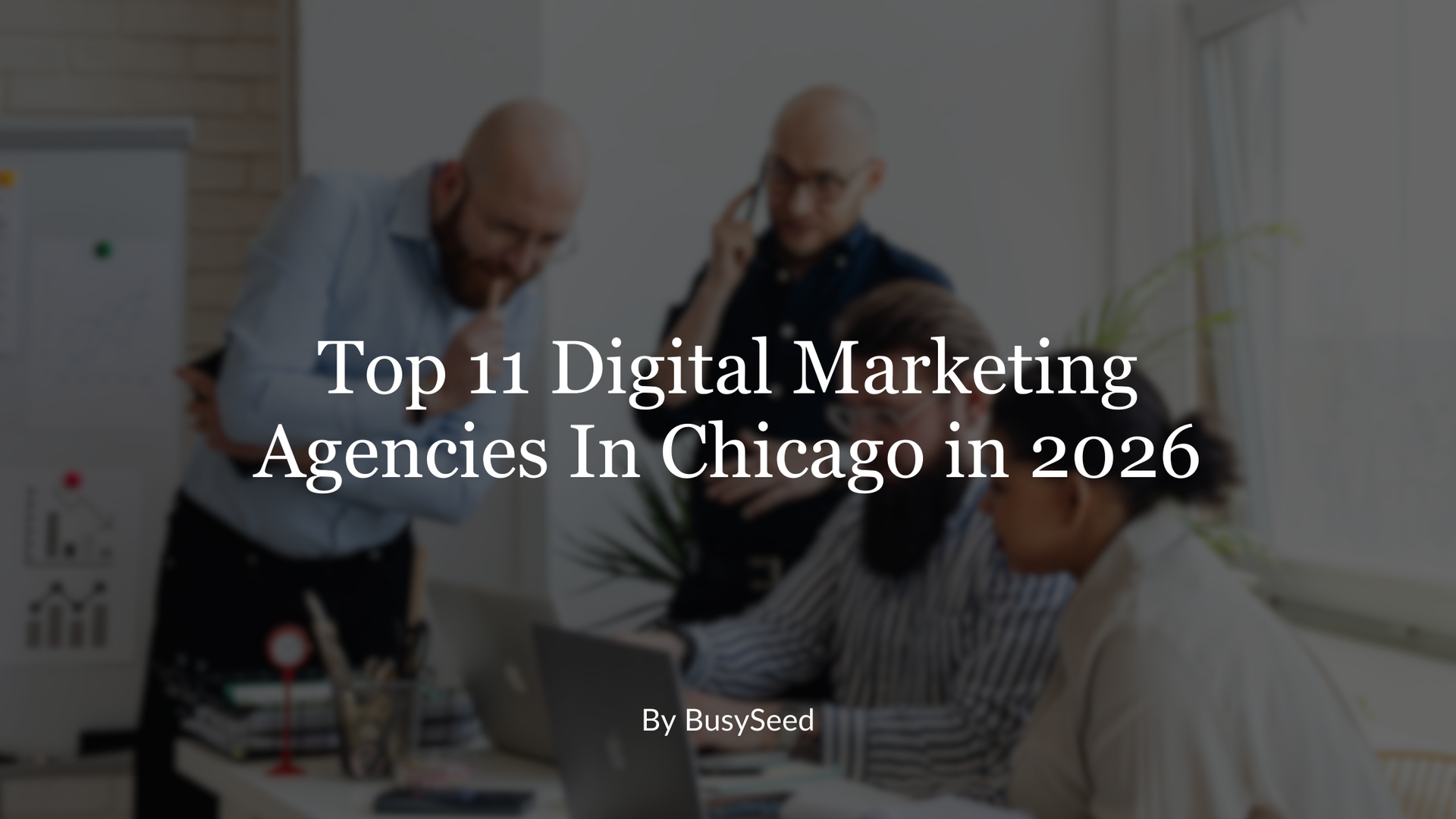 A group of people are having a meeting in a conference room.