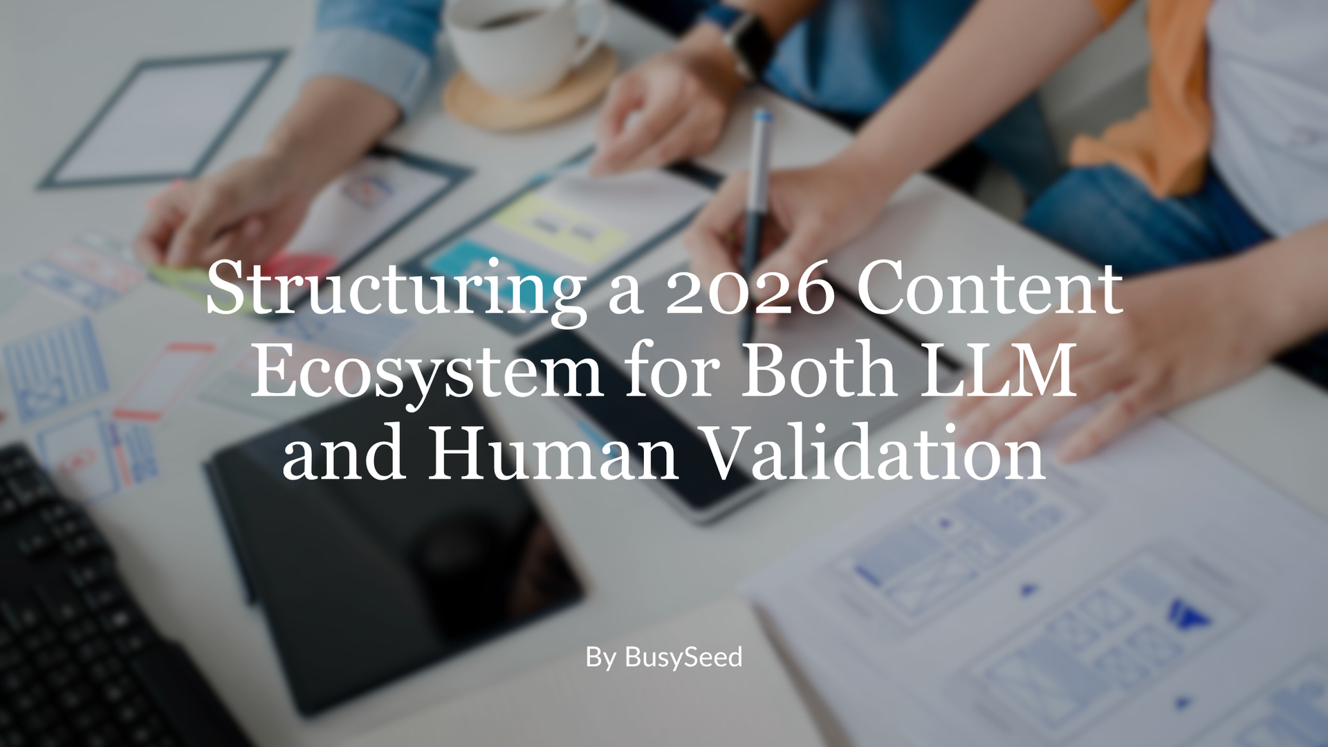 Hands on a laptop and charts at a desk, overlaid with the title “Structuring a 2026 Content Ecosystem for Both I.L.M and Human Validation”
