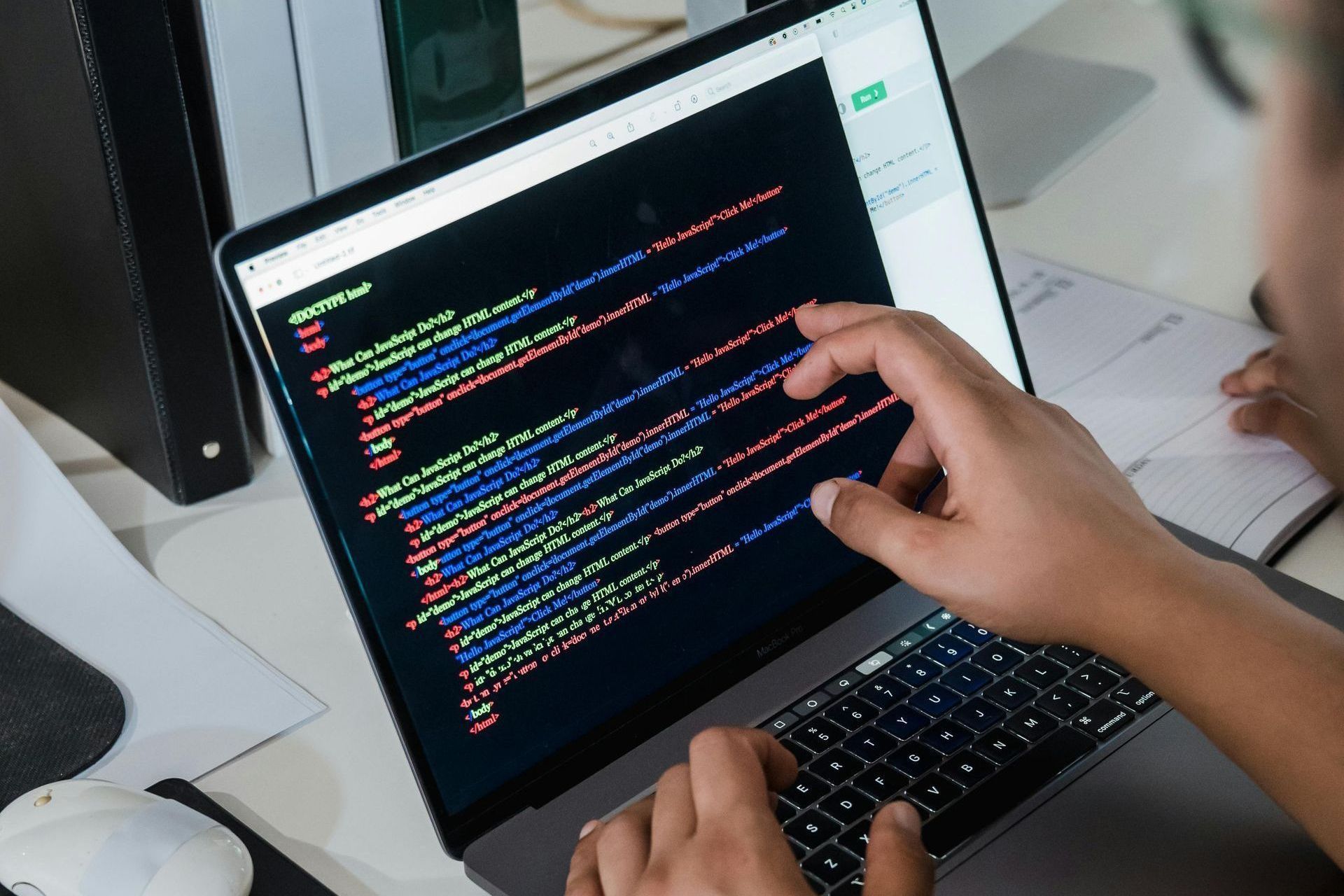 A person is typing on a laptop computer.