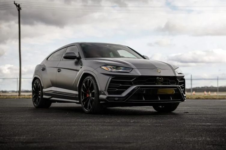 White Mercedes-Benz sedan on a white background, viewed from the side.