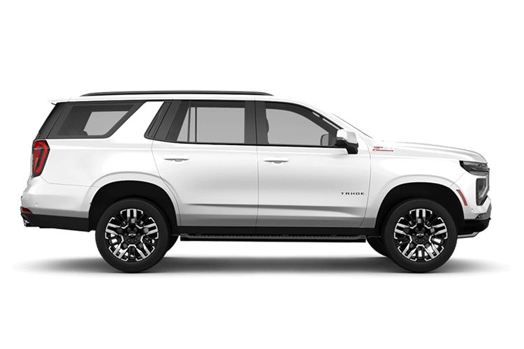 White SUV with black wheels, parked on a surface. Side view of vehicle.