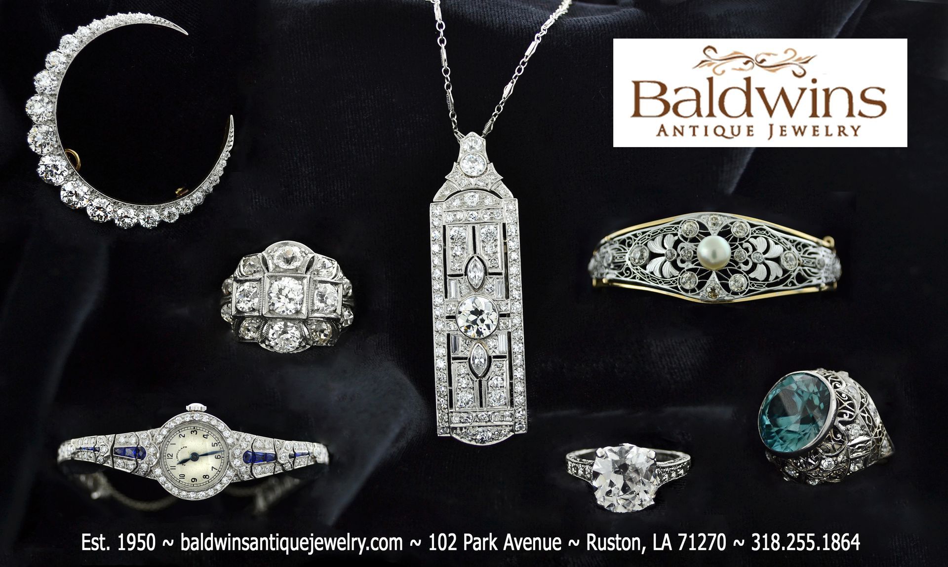 Baldwins antique jewelry is displayed on a black cloth