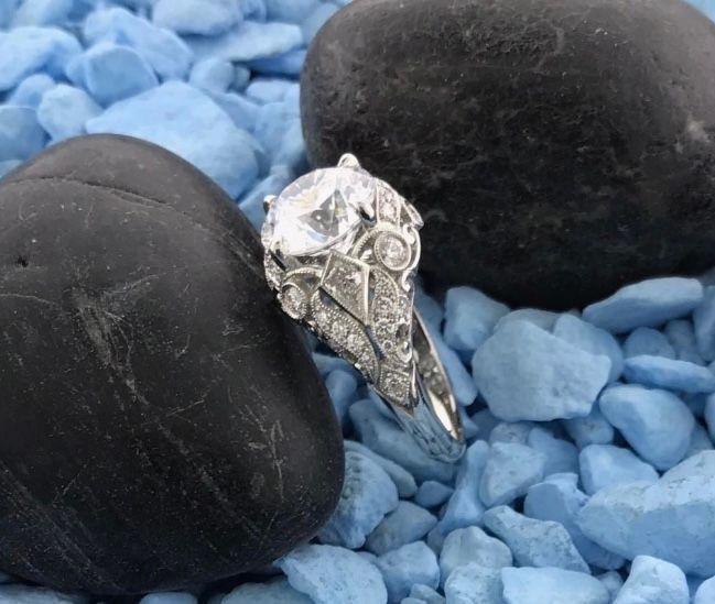 A ring is sitting on a pile of blue rocks