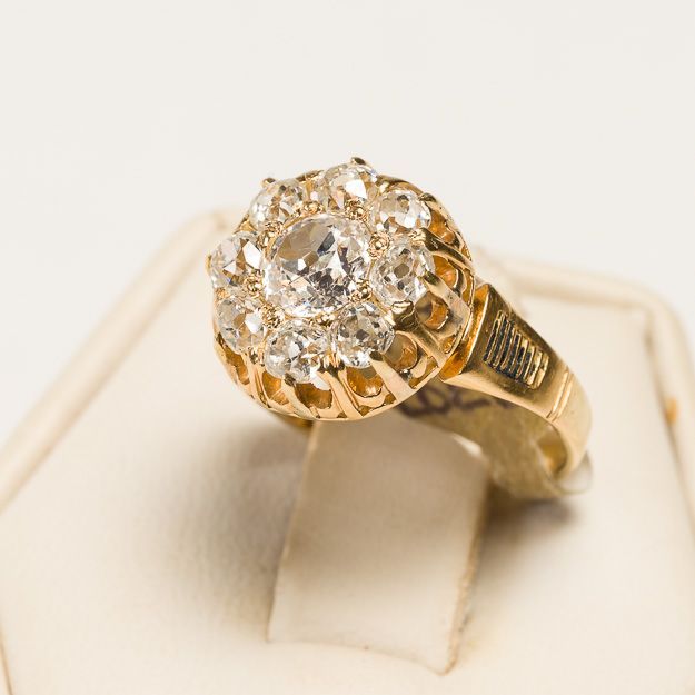 A gold ring with a diamond in the center