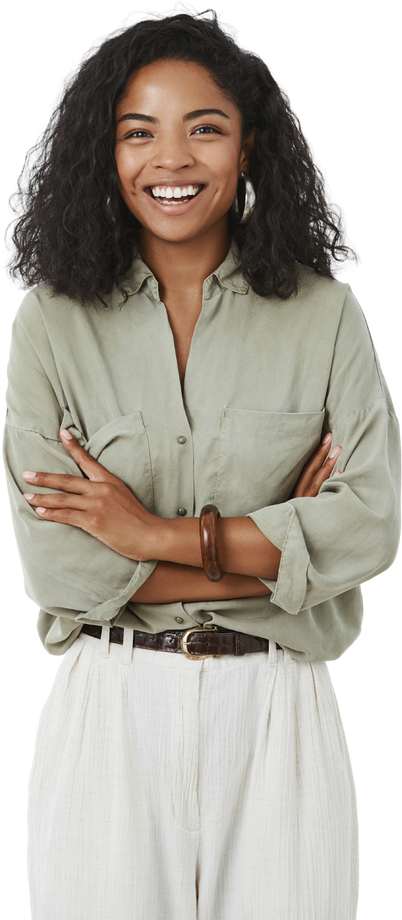 A smiling woman with crossed arms, wearing a green shirt and white pants.