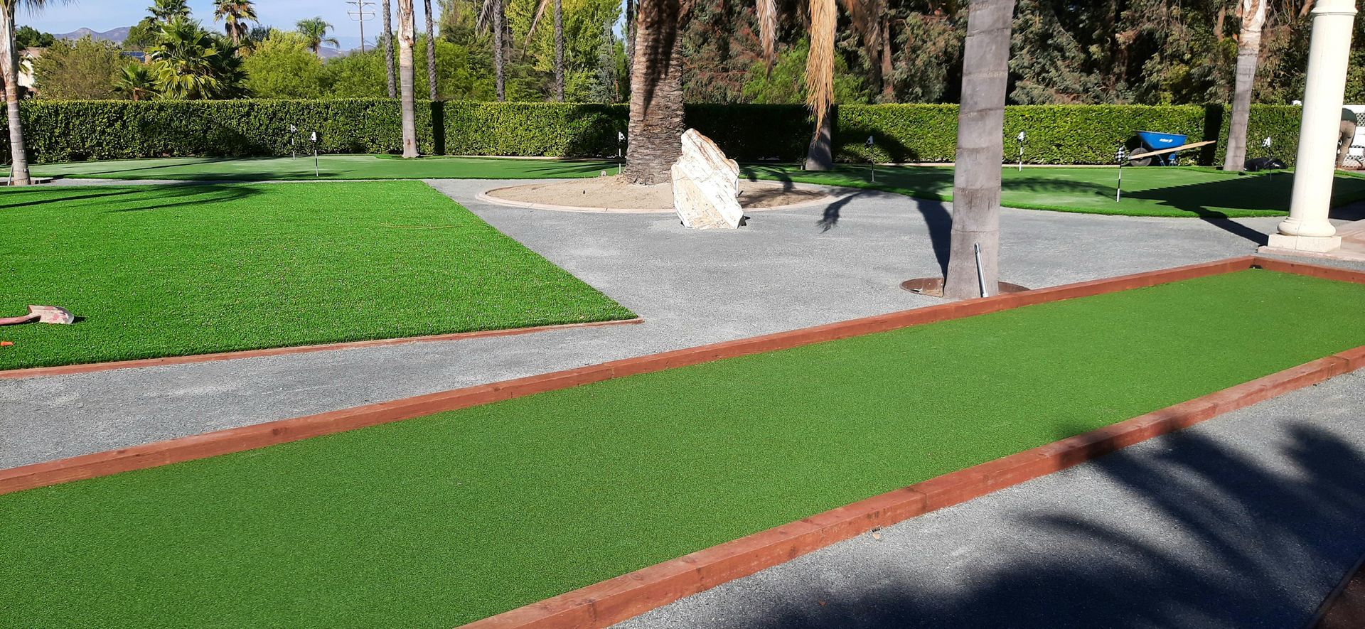 rock feature near  artificial grass