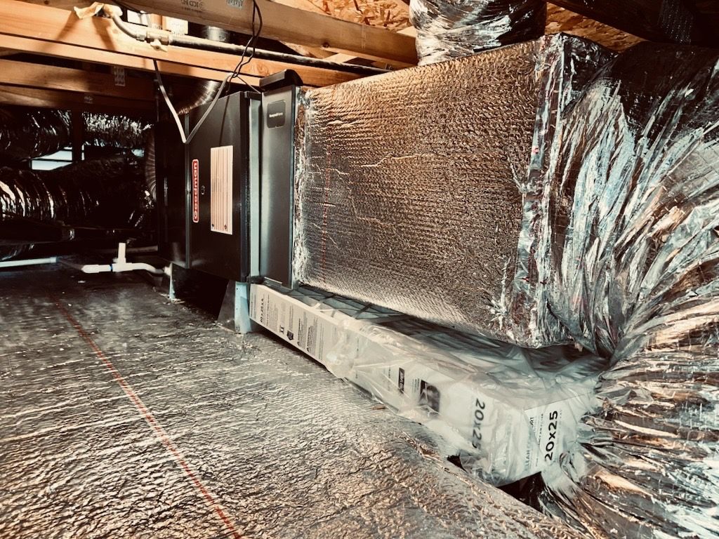 A picture of a duct in a basement.