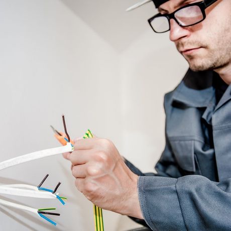 Electrician working with wires