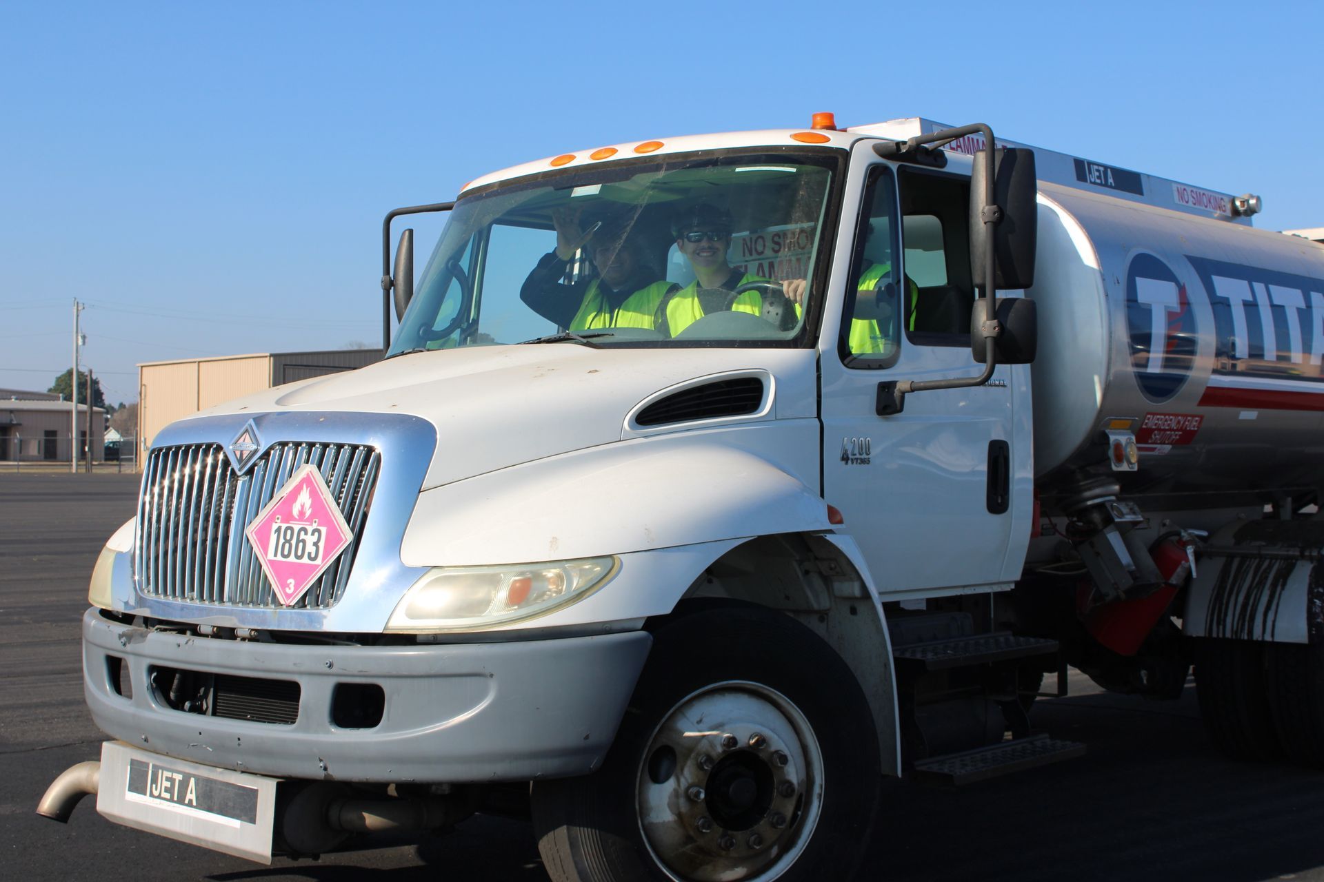 A white tanker truck with a 