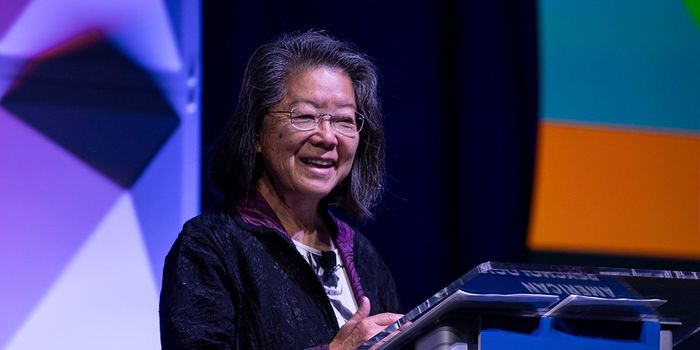 Woman speaking on stage