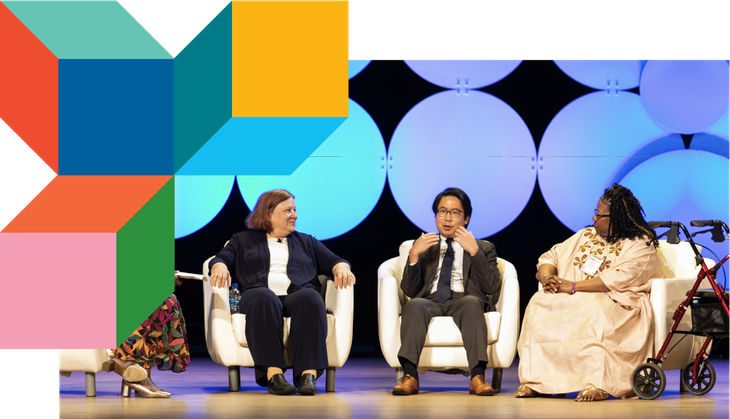 Panelists discuss on stage