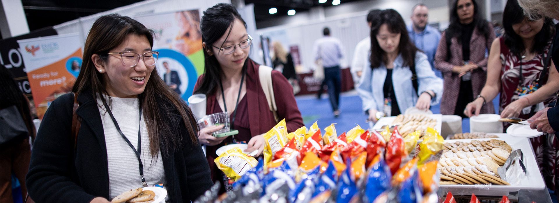 People browsing colorful wrapped snacks 