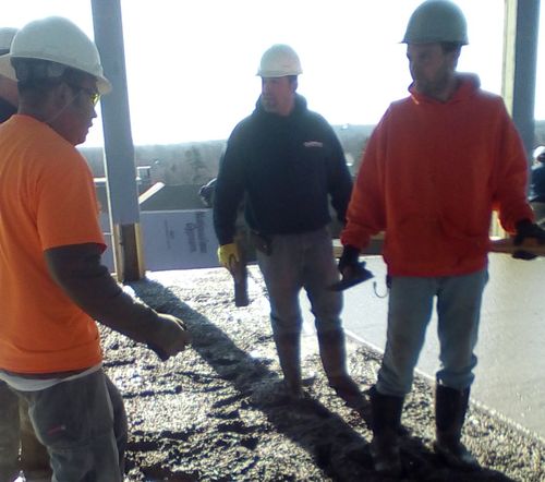 team leaders and member looking at the sketch of the building