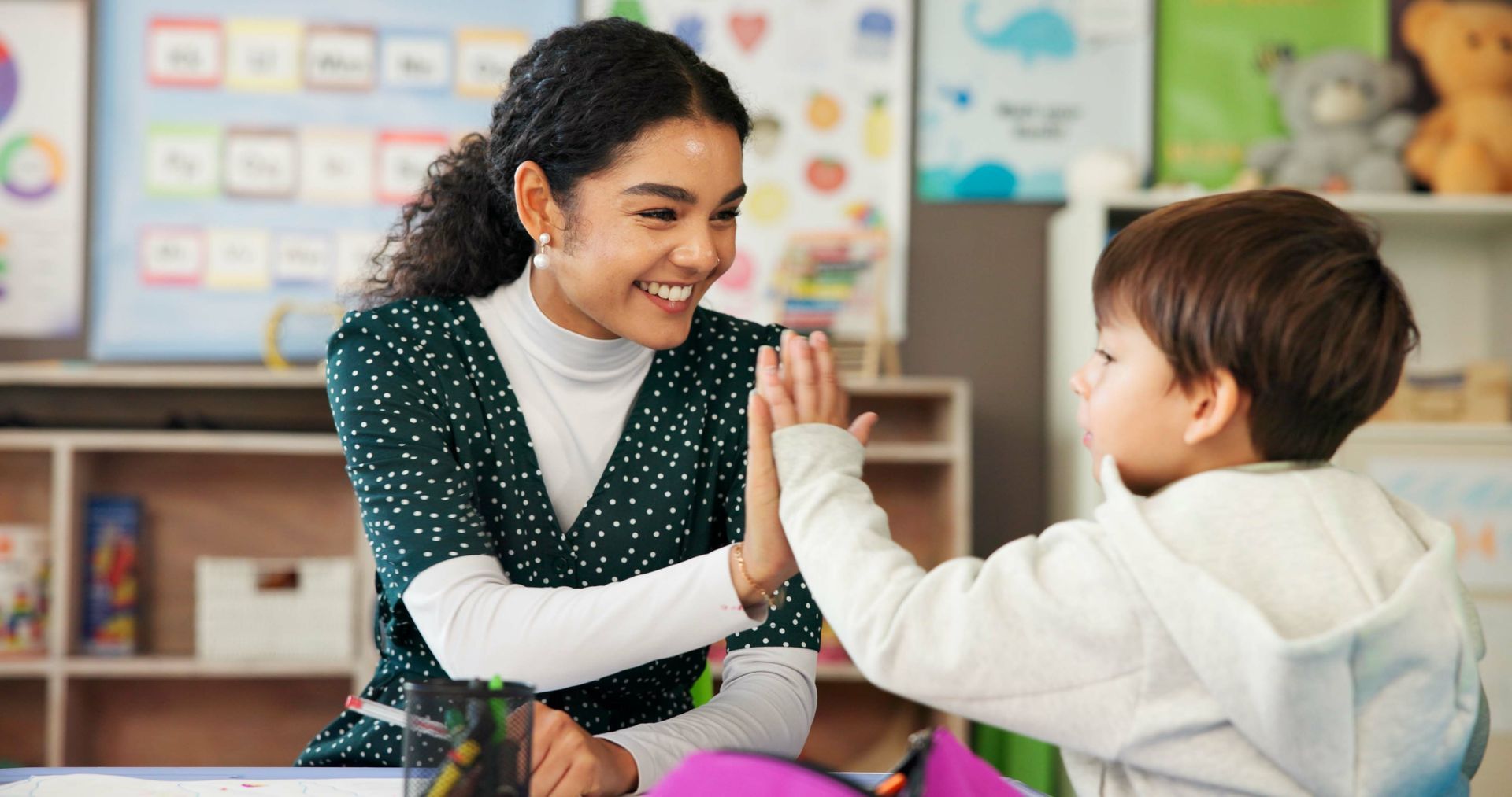 A teacher and a little boy