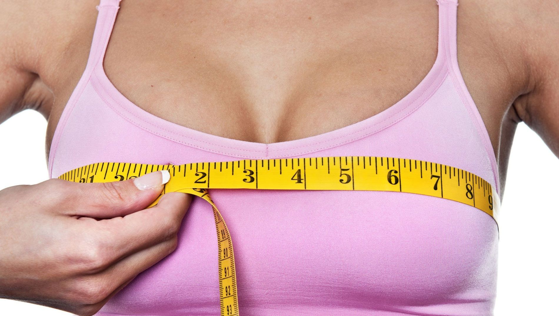 Woman Measuring Her Bust - Knoxville, TN - Dr. Joseph T. Chun, MD, FACS