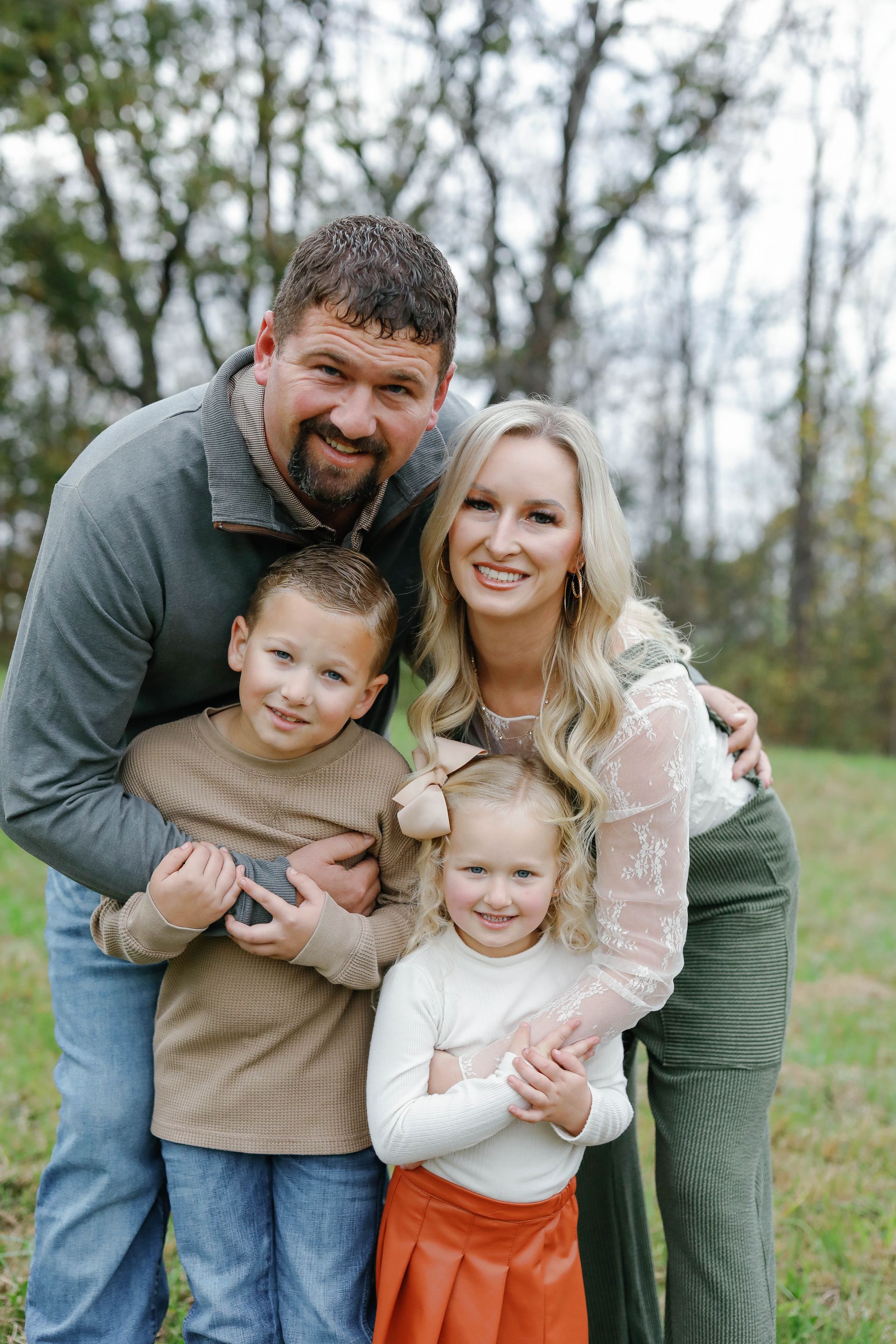 A logo for all seasons landscaping and excavating with a yellow excavator.