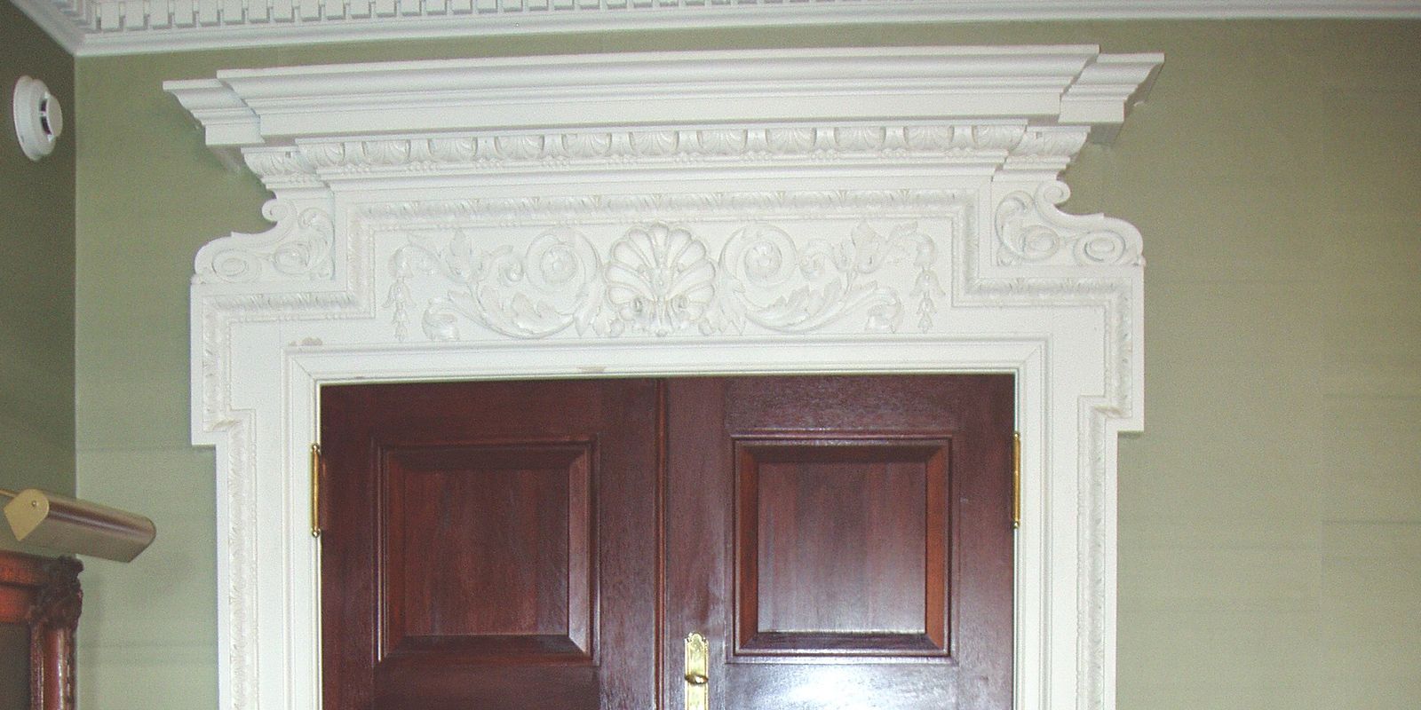 A door with a white molding on the top of it
