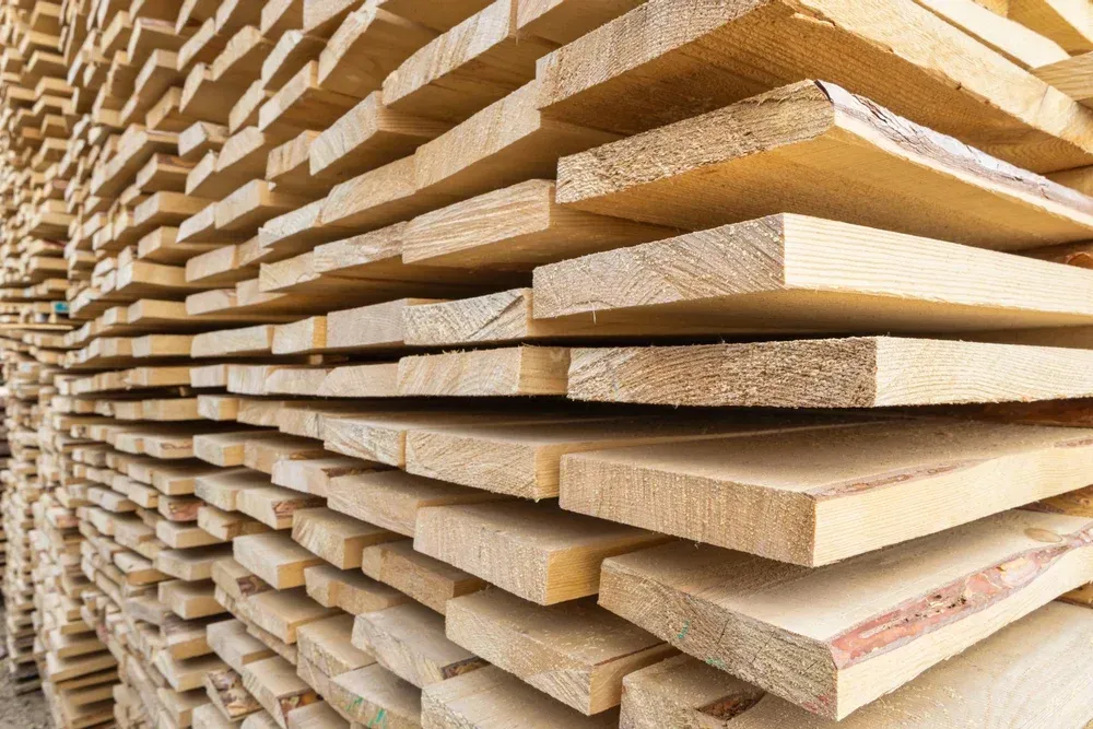 A pile of wooden boards stacked on top of each other.