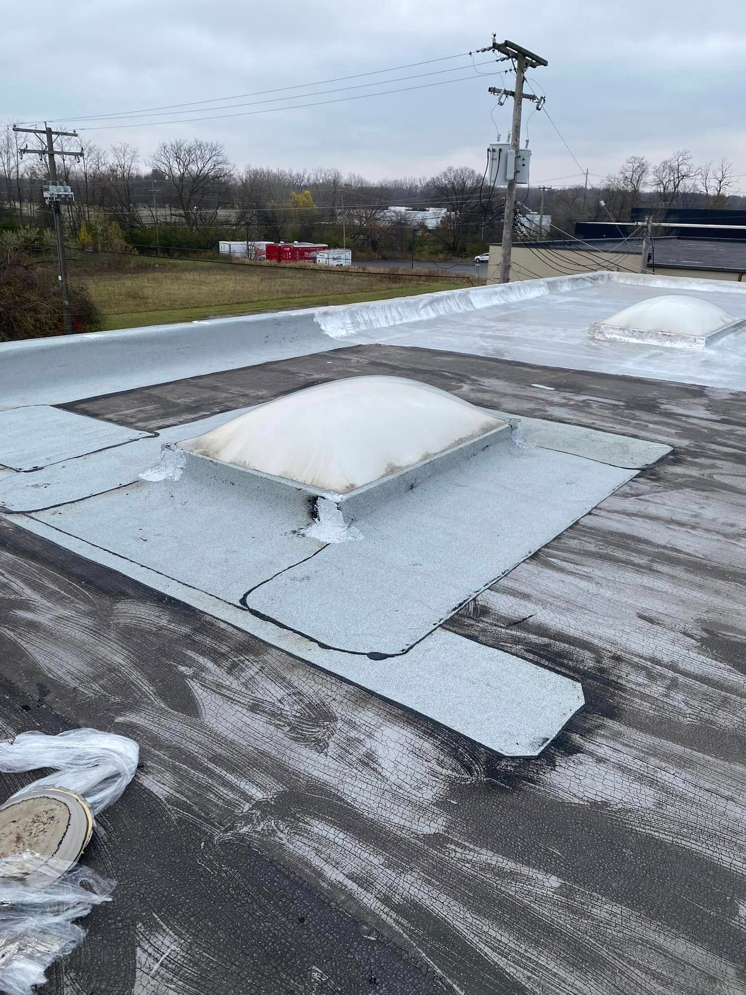 There is a skylight on the roof of a building.