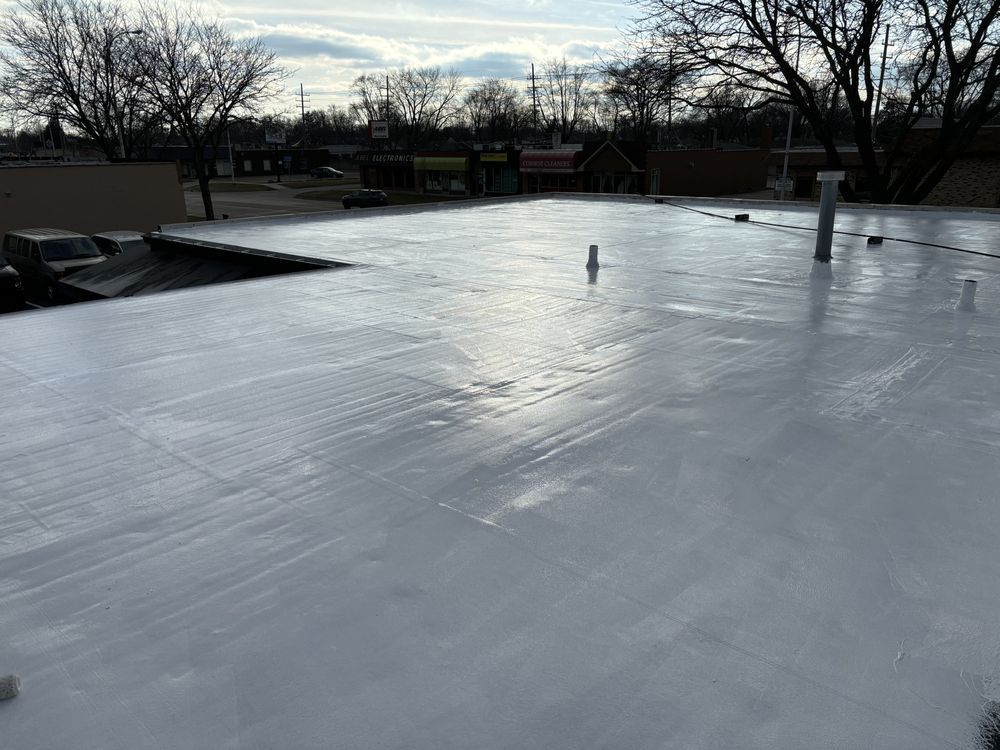 A roof with a white roof and trees in the background.