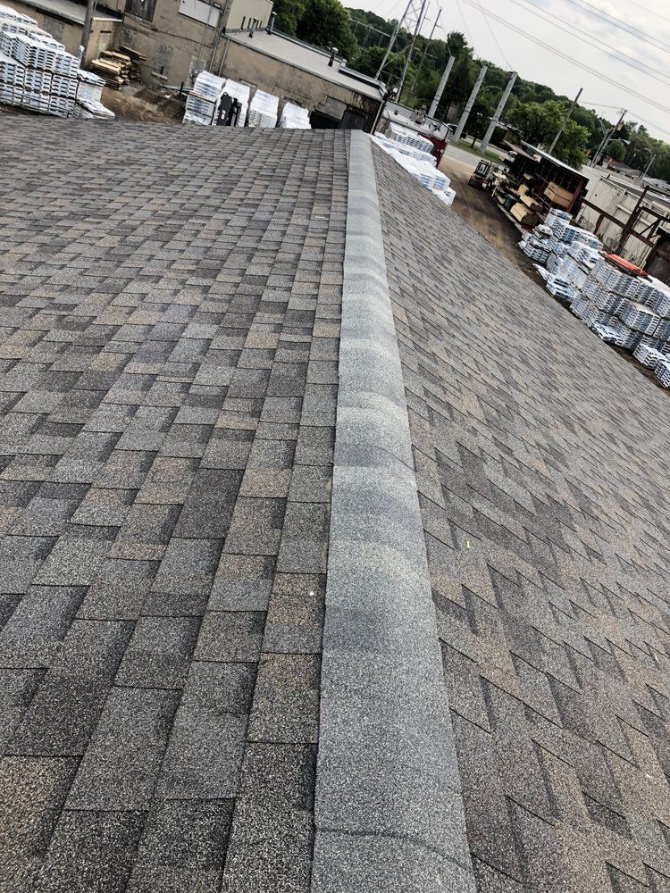 A close up of a roof with shingles on it.