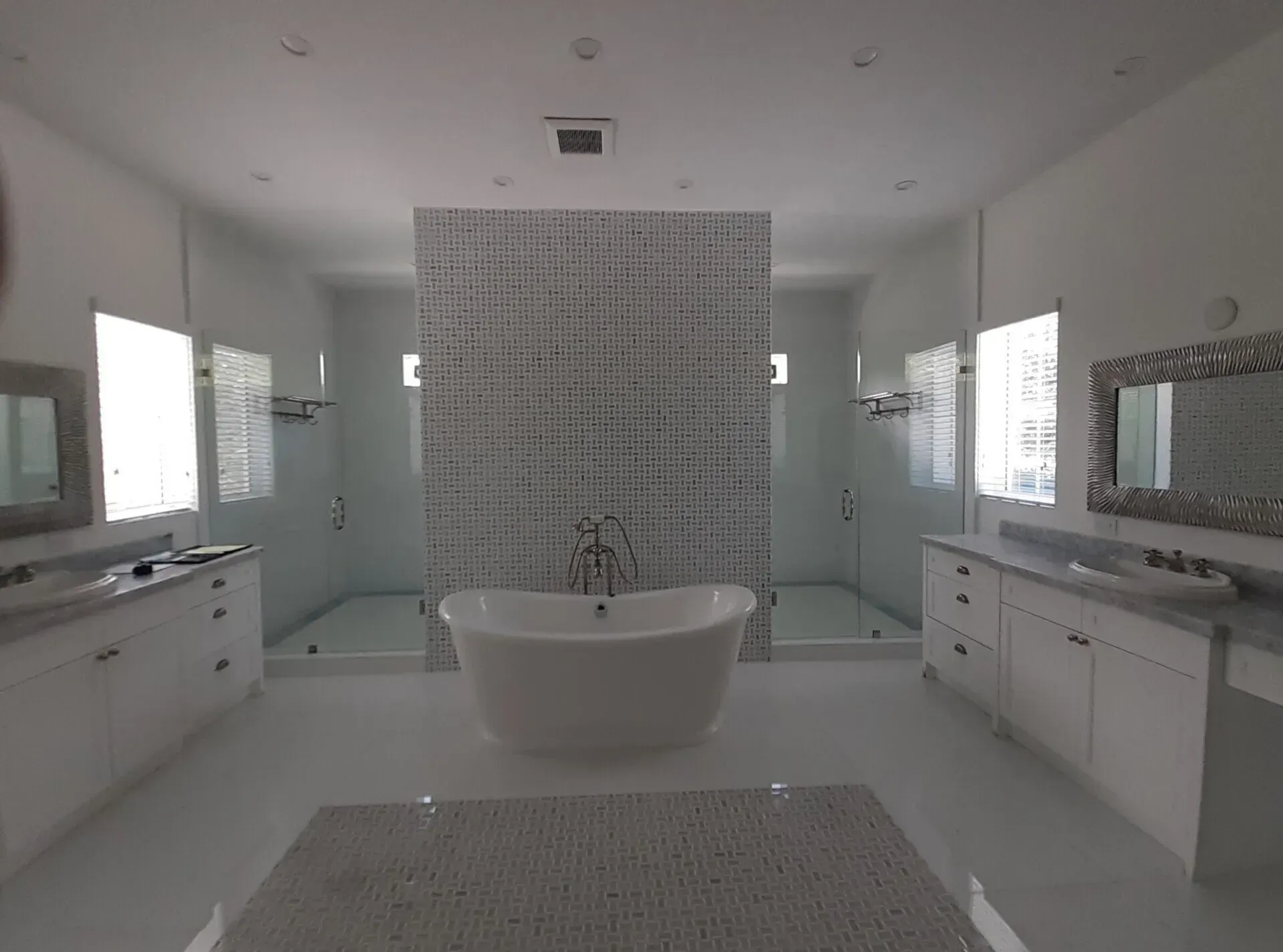 There is a bathtub in the middle of the bathroom.