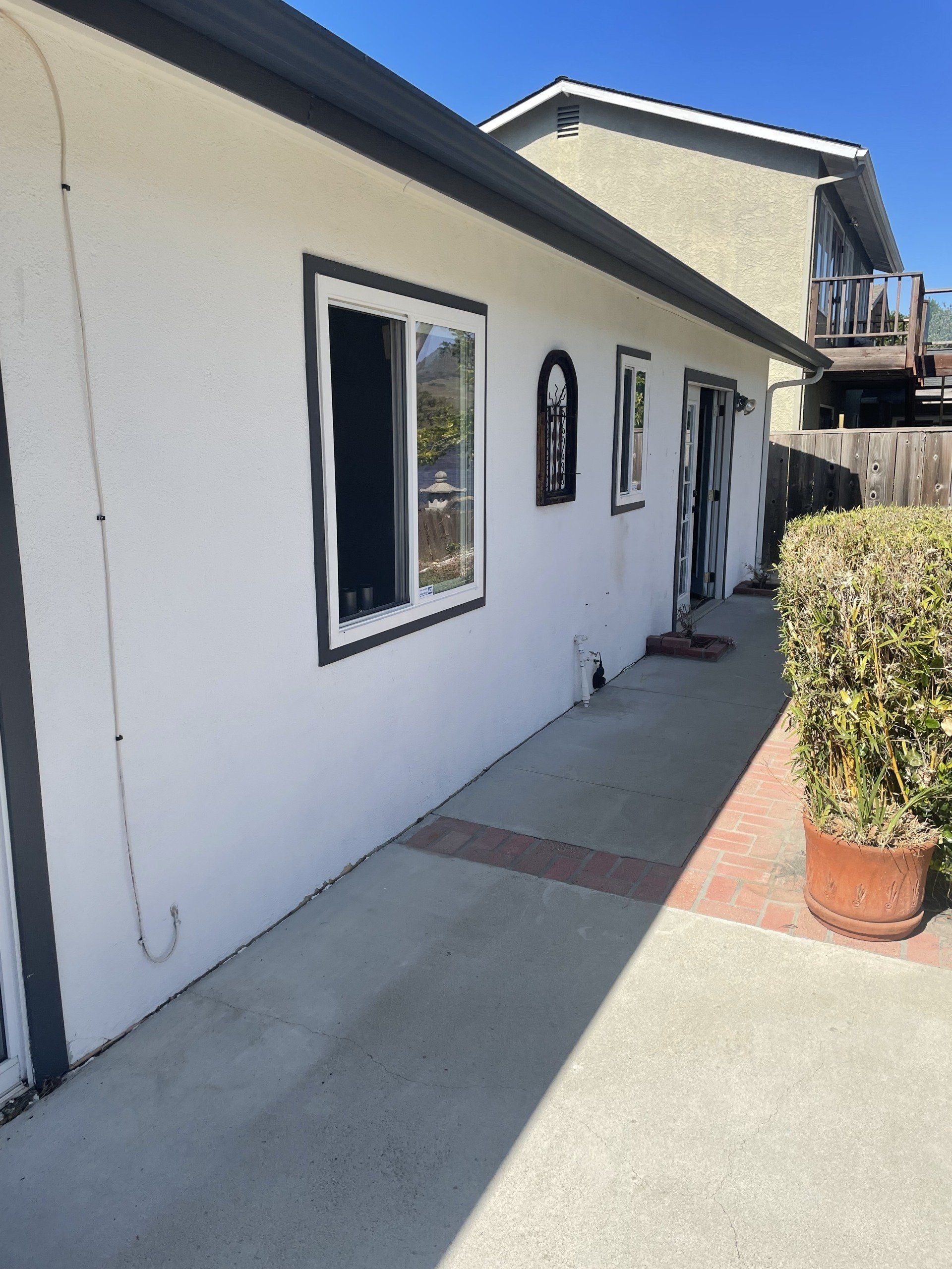 A white house with a lot of windows on it