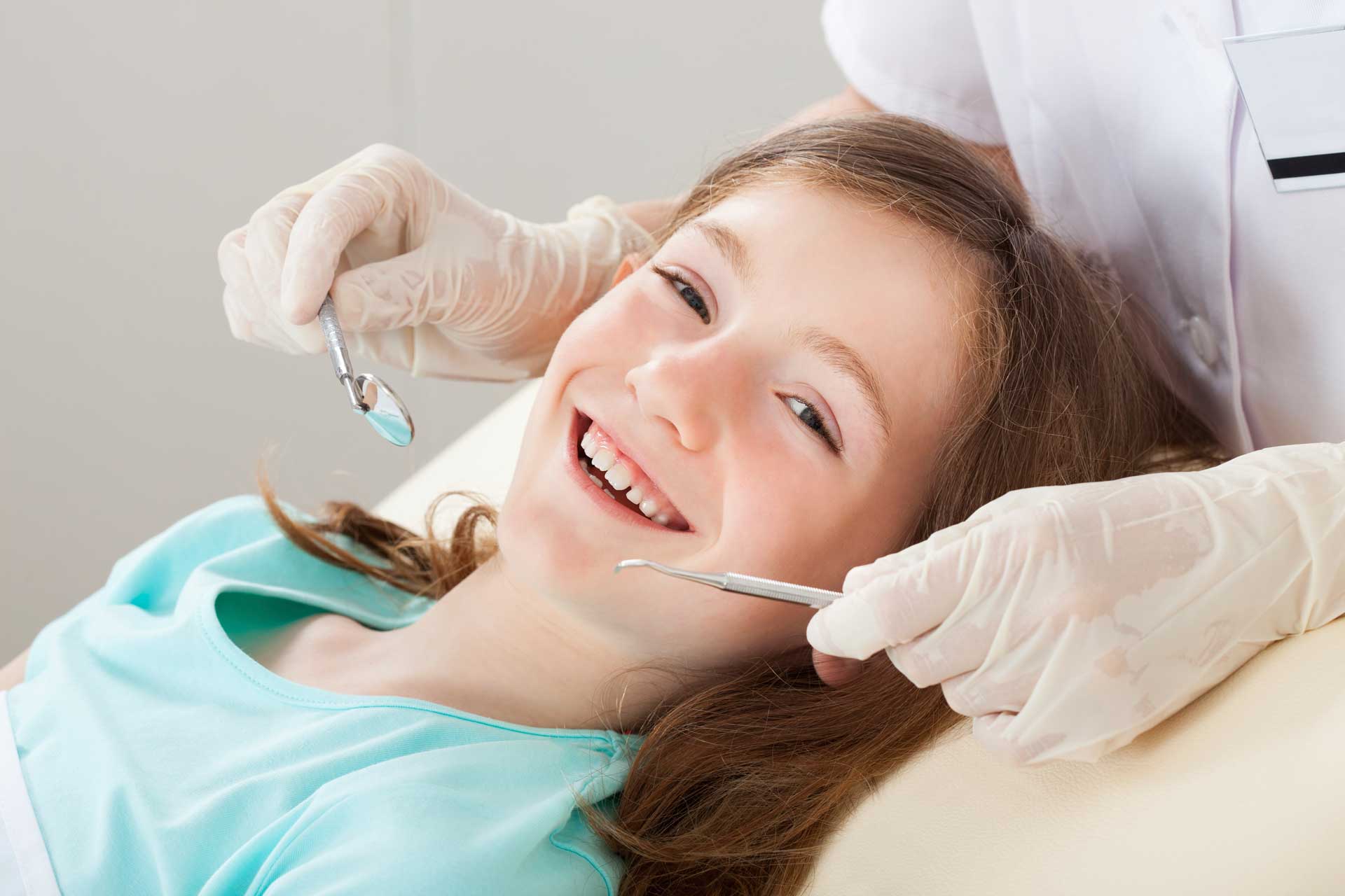 Dental Implants Restoration — Happy Girl Undergoing Dental Treatment in Pittsburgh, PA
