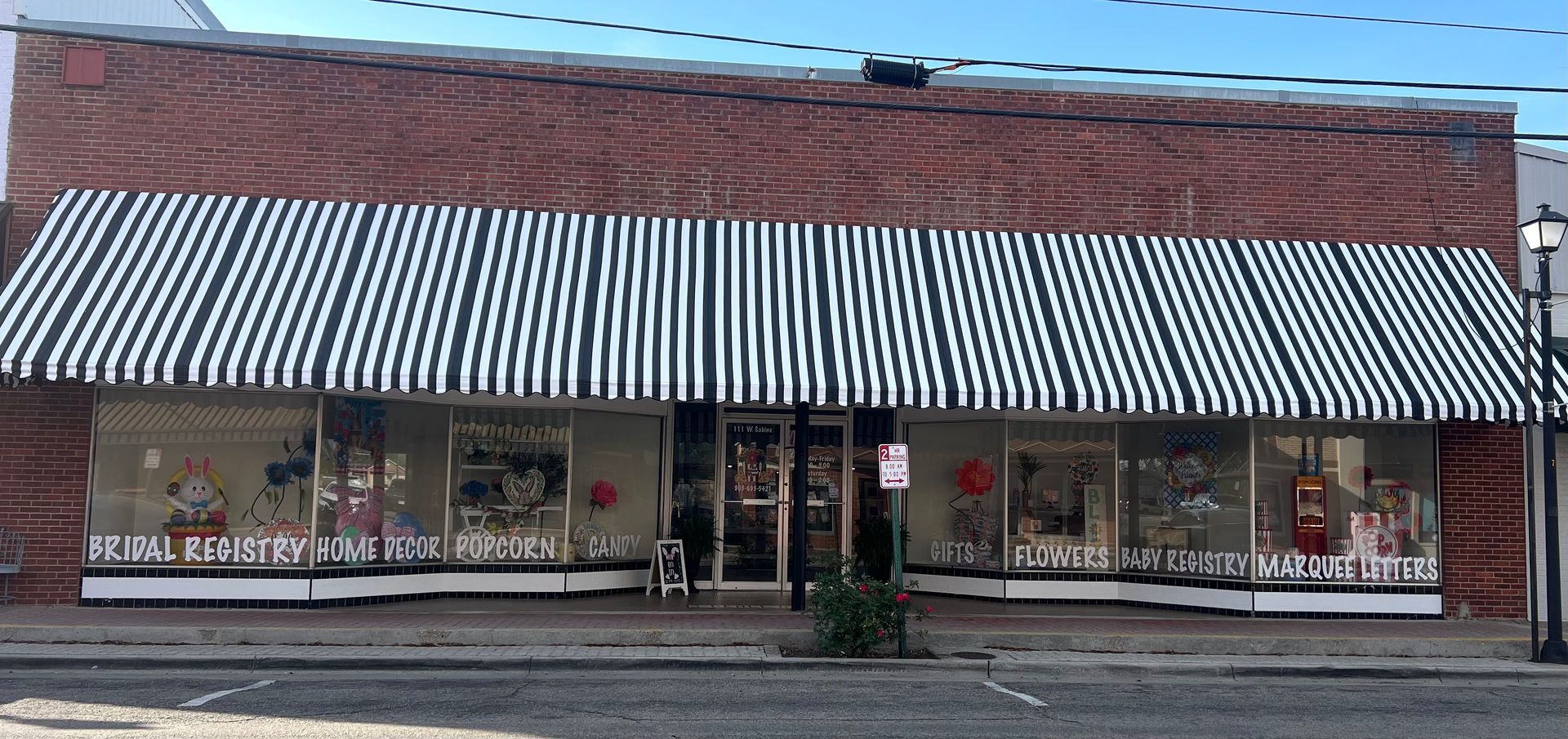 A round container divided into four sections, filled with different flavored popcorn.