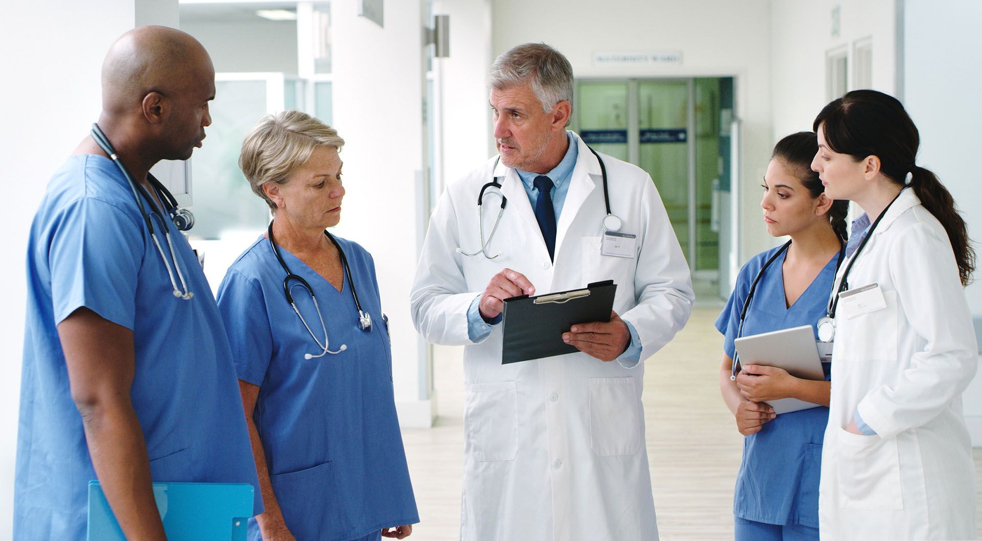 Medical professionals in a hospital hallway
