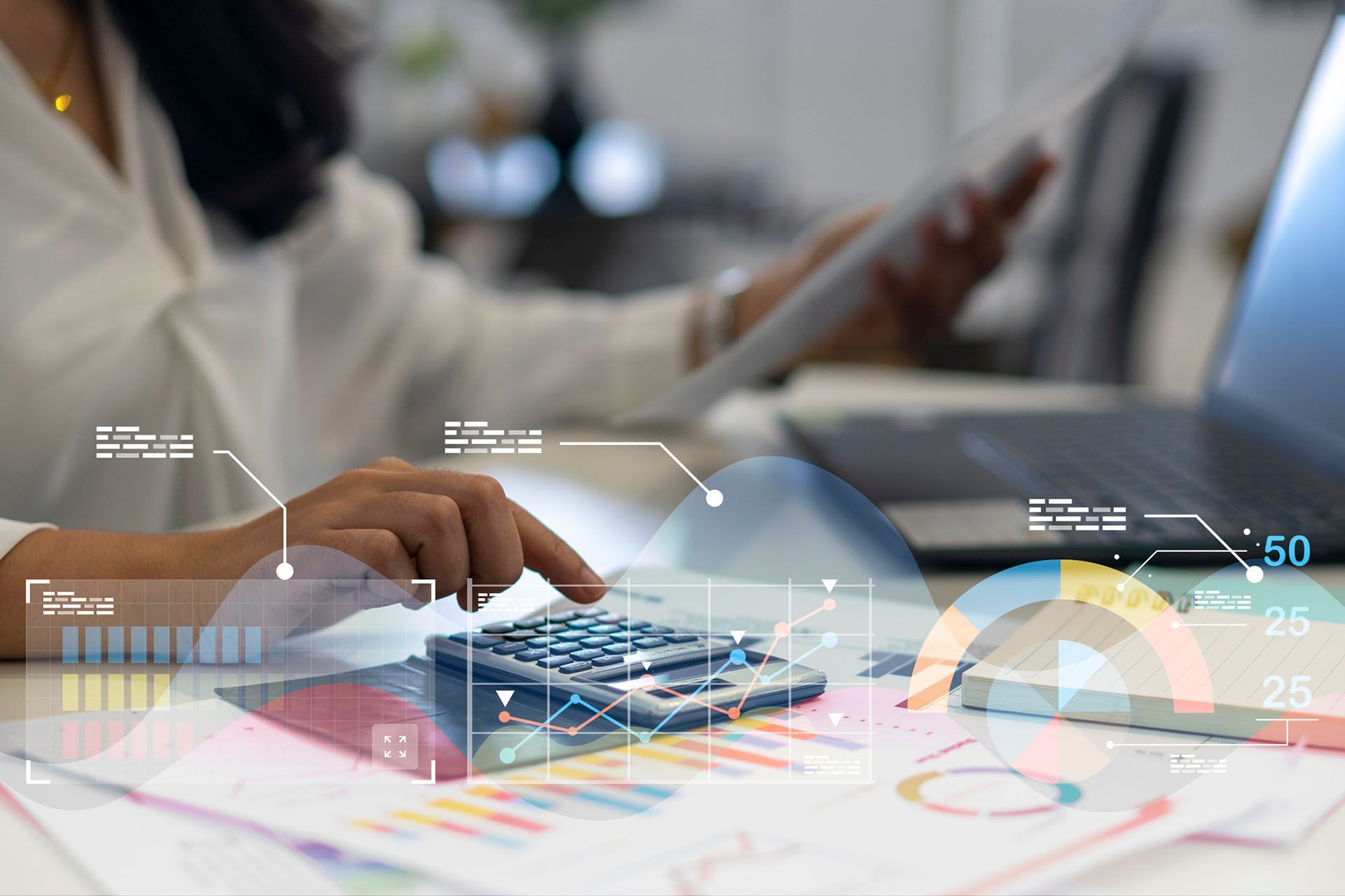 Person using a calculator, laptop, and papers with graphs, overlaid with data visualizations