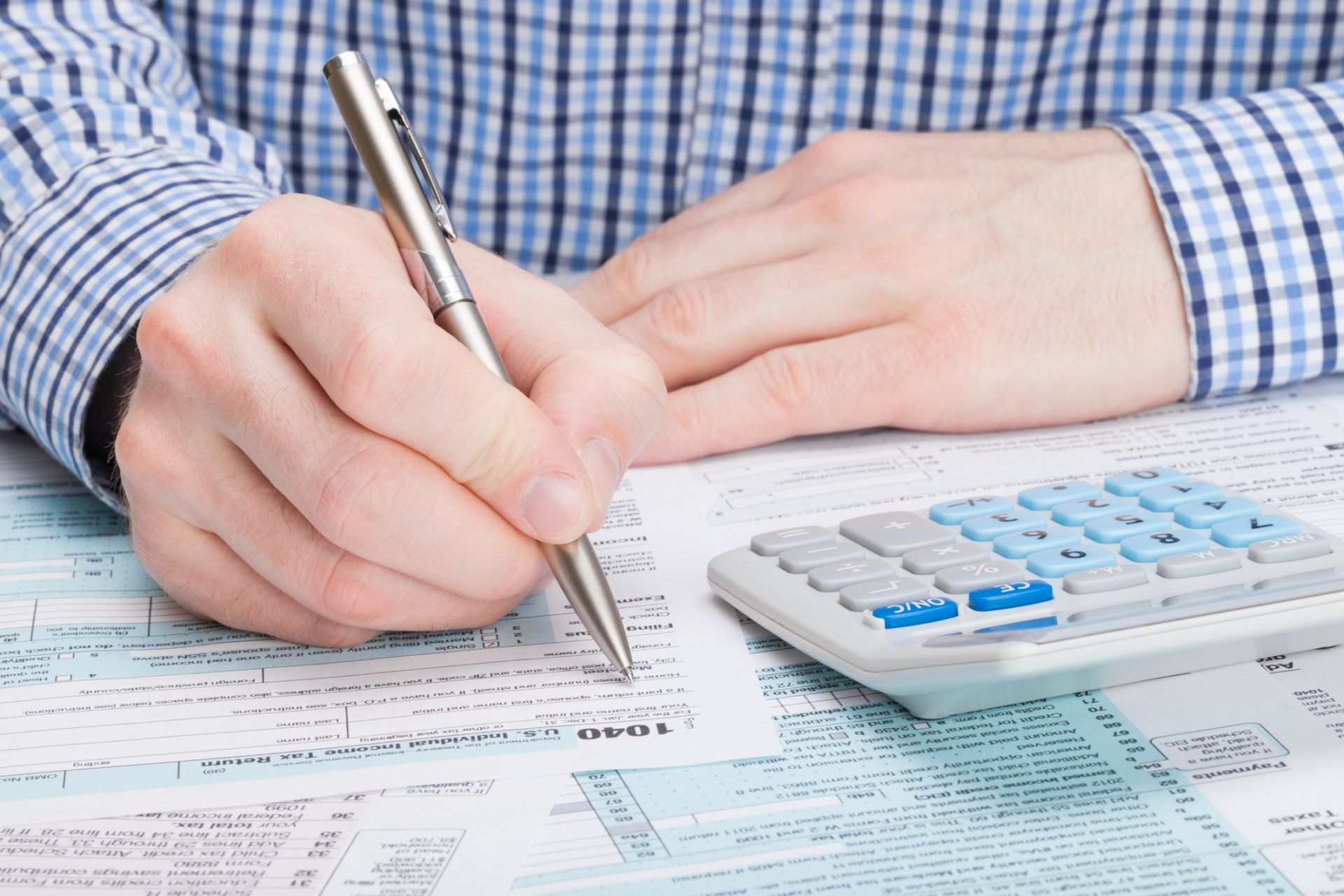 Man Filling Tax Papers – Houston, TX — Ro Watson