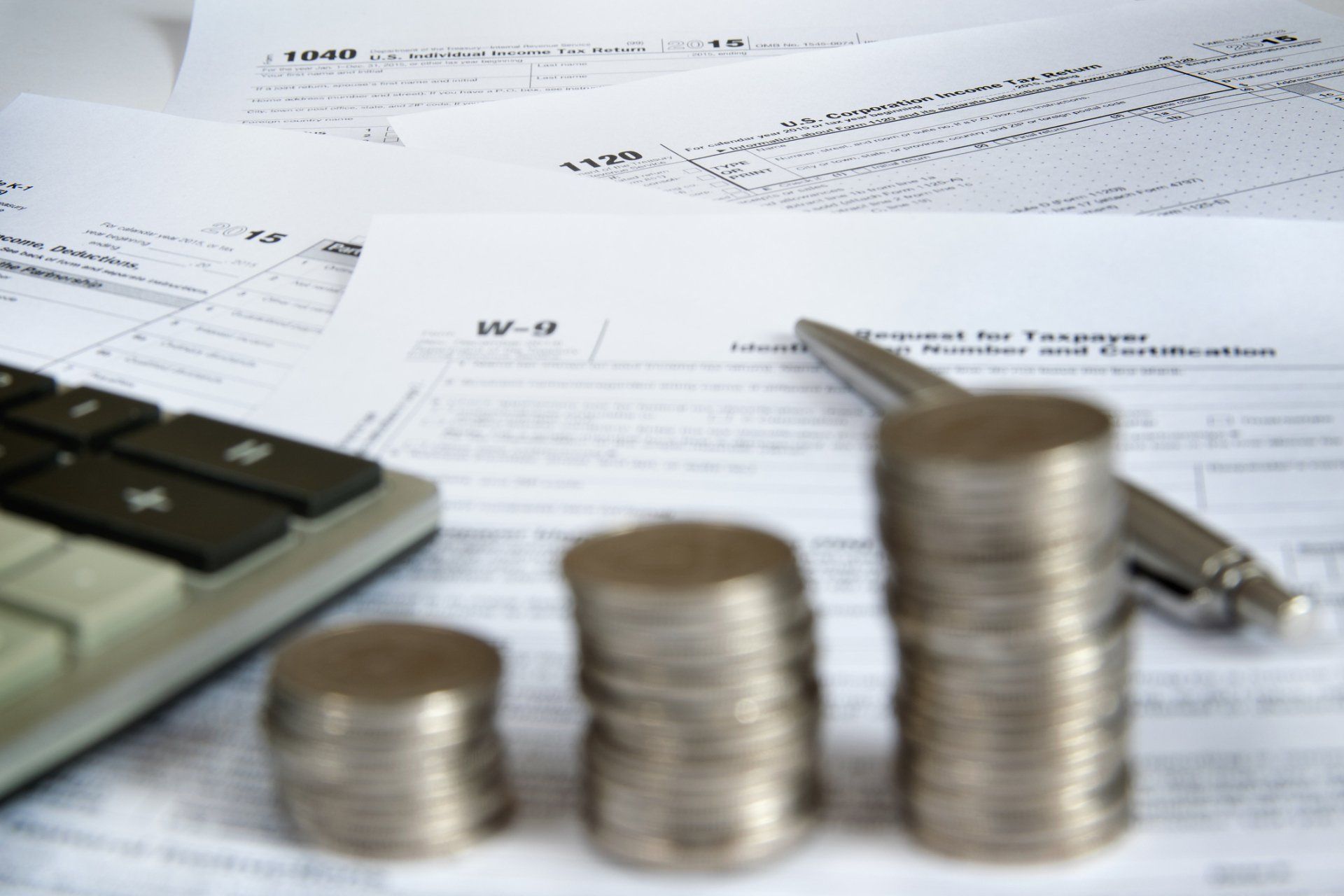 Coins on Top of Tax Forms – Houston, TX — Ro Watson