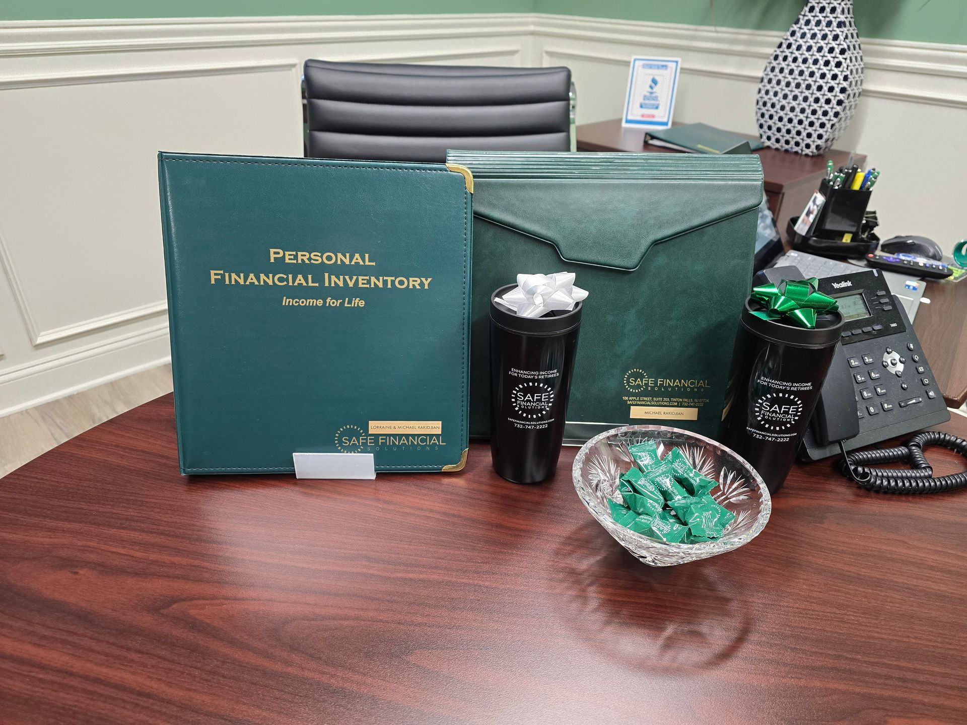 A black and white photo of an older man holding glasses.