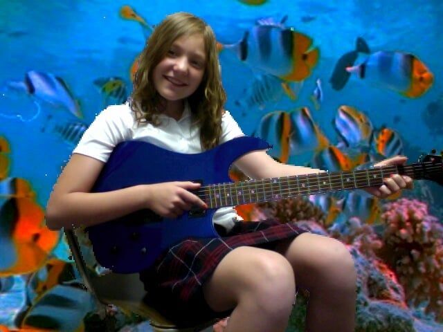 Girl with blue guitar and underwater background