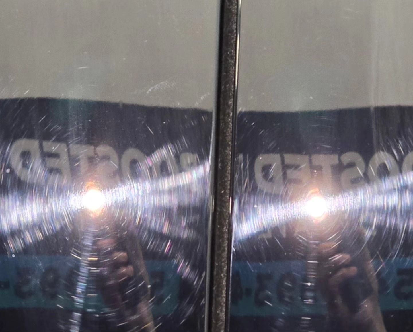 A person is taking a picture of their reflection in a mirror